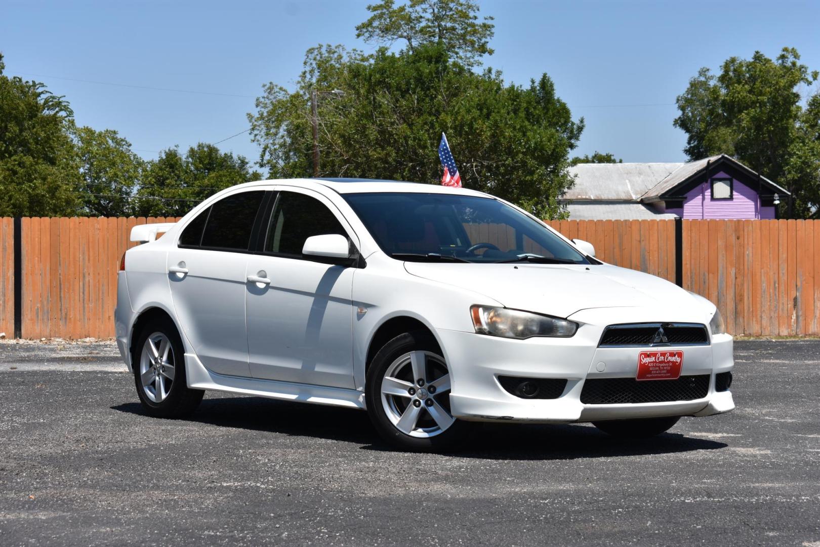 2009 WHITE /BLACK MITSUBISHI LANCER (JA3AU26U29U) with an 2.OL 4 CYLINDER engine, AUTOMATIC transmission, located at 420 E. Kingsbury St., Seguin, TX, 78155, (830) 401-0495, 29.581060, -97.961647 - Photo#1