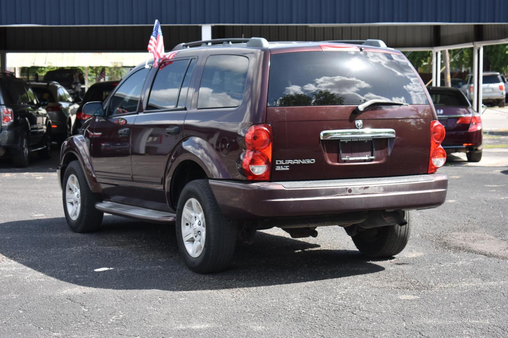 2005 MAROON Dodge Durango Adventurer Model 2WD (1D4HD48KX5F) with an 3.7L V6 SOHC 12V engine, 5-Speed Automatic Overdrive transmission, located at 420 E. Kingsbury St., Seguin, TX, 78155, (830) 401-0495, 29.581060, -97.961647 - Photo#2