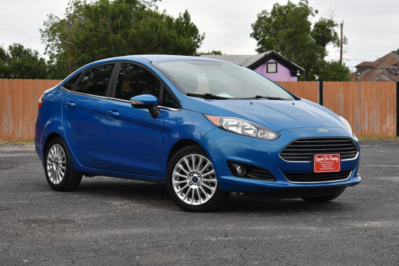 2015 BLUE Ford Fiesta Titanium Sedan (3FADP4CJ1FM) with an 1.6L L4 DOHC 16V engine, located at 420 E. Kingsbury St., Seguin, TX, 78155, (830) 401-0495, 29.581060, -97.961647 - Photo#1