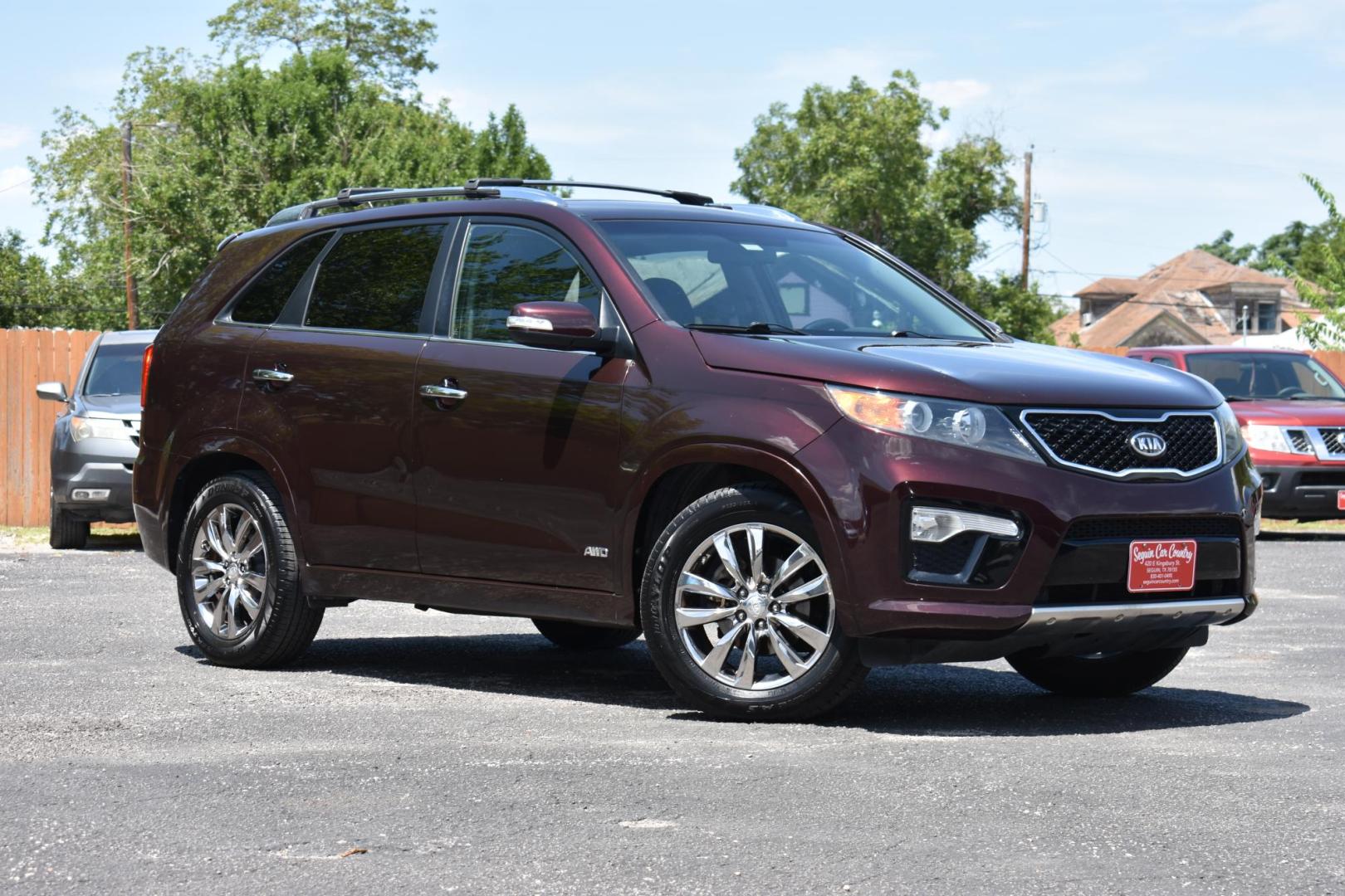 2013 MAROON Kia Sorento SX 4WD (5XYKWDA25DG) with an 3.5L V6 DOHC 24V engine, 6-Speed Automatic transmission, located at 420 E. Kingsbury St., Seguin, TX, 78155, (830) 401-0495, 29.581060, -97.961647 - Photo#1
