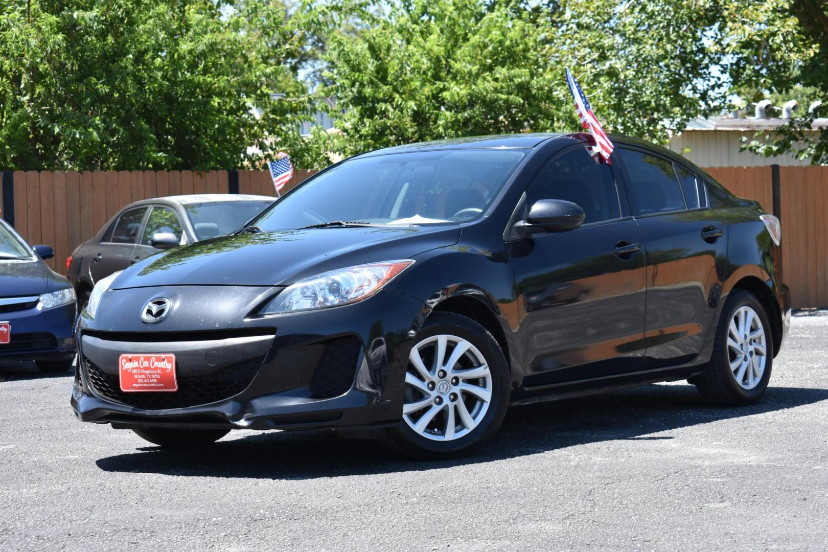 2012 BLACK Mazda MAZDA3 i Touring 4-Door (JM1BL1V78C1) with an 2.0L L4 DOHC 16V engine, located at 420 E. Kingsbury St., Seguin, TX, 78155, (830) 401-0495, 29.581060, -97.961647 - Photo#3