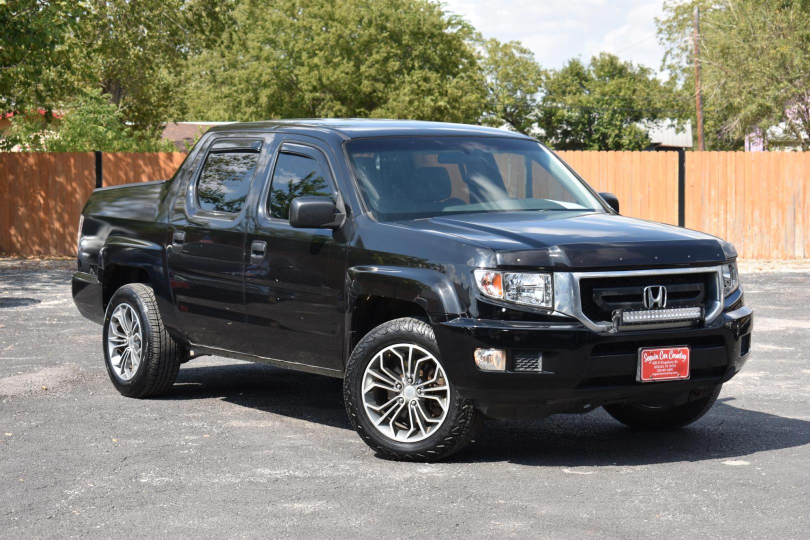 2011 BLACK Honda Ridgeline RTS (5FPYK1F4XBB) with an 3.5L V6 SOHC 24V engine, 5-Speed Automatic transmission, located at 420 E. Kingsbury St., Seguin, TX, 78155, (830) 401-0495, 29.581060, -97.961647 - Photo#1