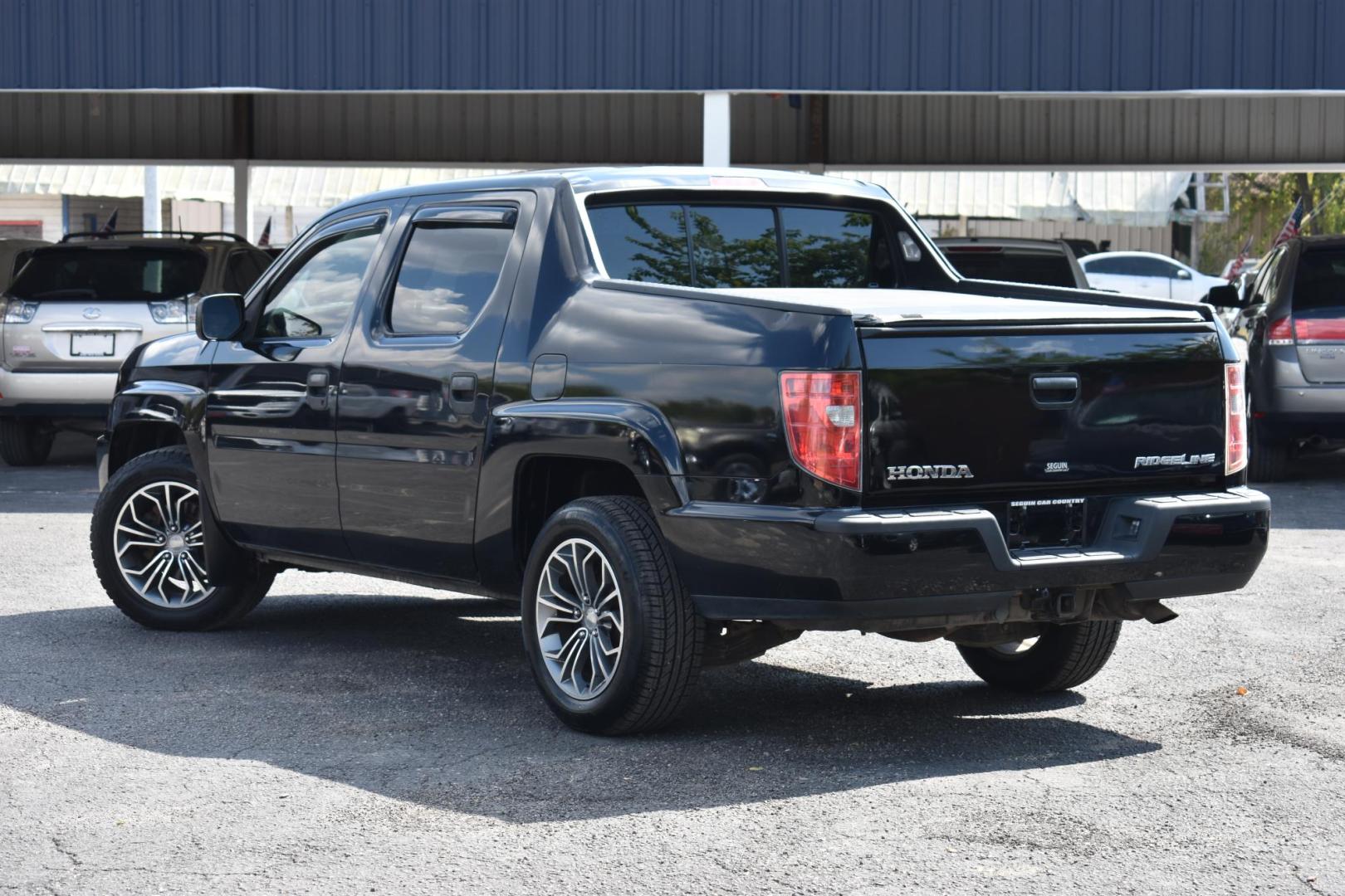 2011 BLACK Honda Ridgeline RTS (5FPYK1F4XBB) with an 3.5L V6 SOHC 24V engine, 5-Speed Automatic transmission, located at 420 E. Kingsbury St., Seguin, TX, 78155, (830) 401-0495, 29.581060, -97.961647 - Photo#2