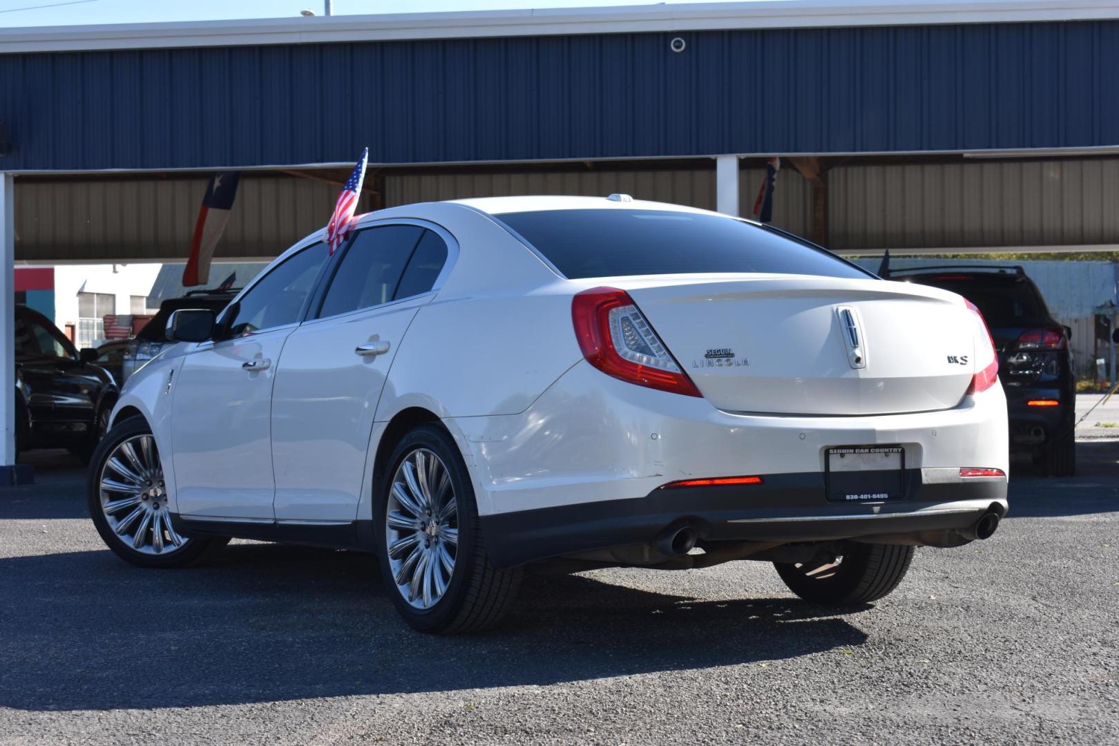 2013 WHITE Lincoln MKS FWD (1LNHL9DK6DG) with an 3.5L V6 DOHC 24V engine, 6-Speed Automatic transmission, located at 420 E. Kingsbury St., Seguin, TX, 78155, (830) 401-0495, 29.581060, -97.961647 - Photo#1
