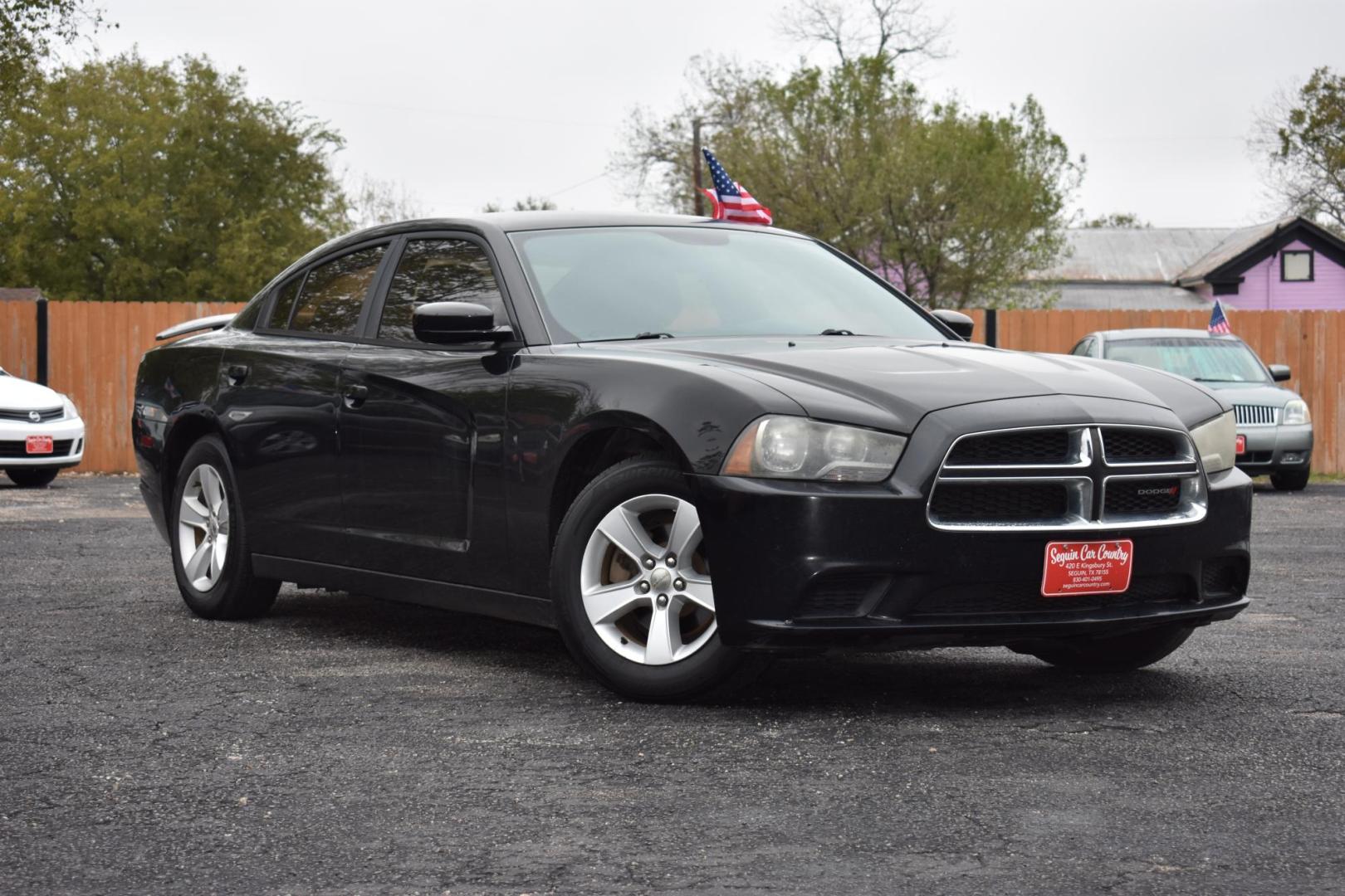 2014 BLACK Dodge Charger SE (2C3CDXBG9EH) with an 3.6L V6 DOHC 24V engine, 5-Speed Automatic transmission, located at 420 E. Kingsbury St., Seguin, TX, 78155, (830) 401-0495, 29.581060, -97.961647 - Photo#1