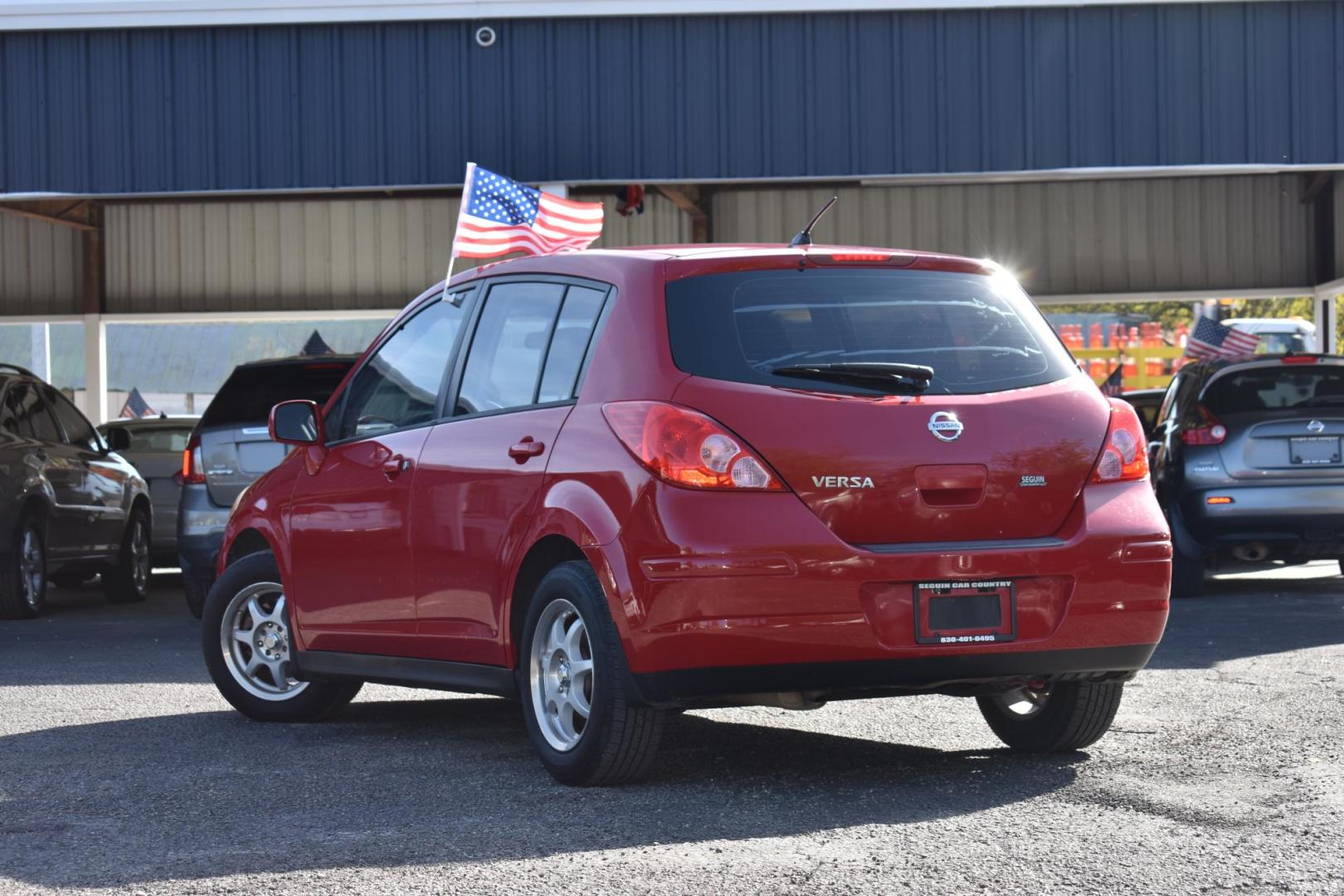 2011 RED Nissan Versa 1.8 S Hatchback (3N1BC1CP7BL) with an 1.8L L4 DOHC 16V engine, located at 420 E. Kingsbury St., Seguin, TX, 78155, (830) 401-0495, 29.581060, -97.961647 - Photo#1