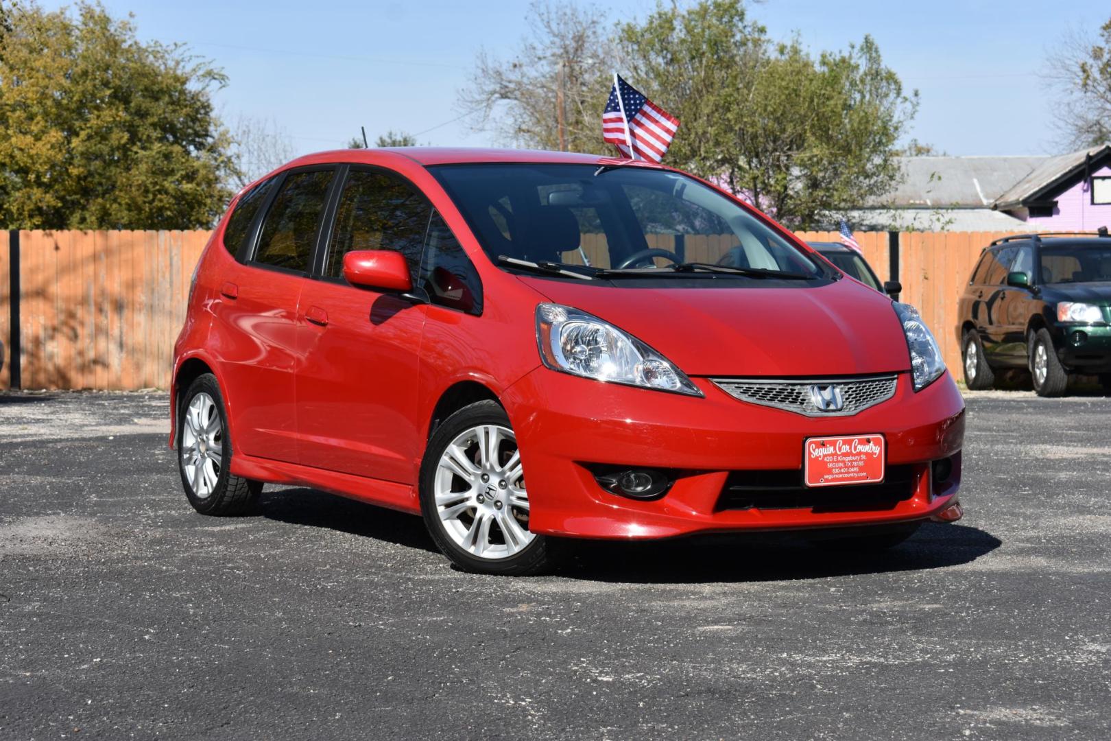 2011 RED Honda Fit Sport 5-Speed AT (JHMGE8H56BC) with an 1.5L L4 SOHC 16V engine, 5-Speed Automatic transmission, located at 420 E. Kingsbury St., Seguin, TX, 78155, (830) 401-0495, 29.581060, -97.961647 - Photo#1