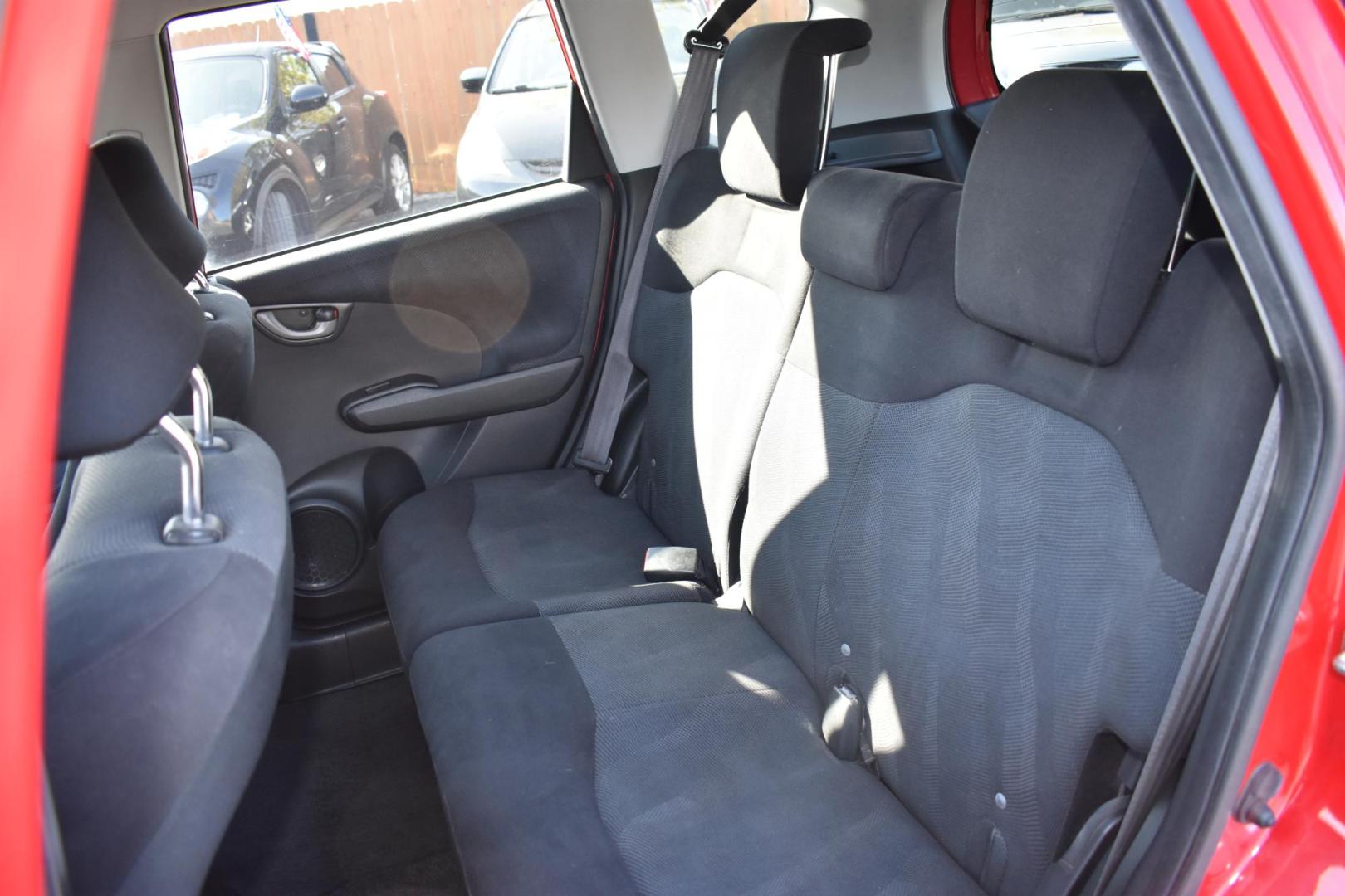 2011 RED Honda Fit Sport 5-Speed AT (JHMGE8H56BC) with an 1.5L L4 SOHC 16V engine, 5-Speed Automatic transmission, located at 420 E. Kingsbury St., Seguin, TX, 78155, (830) 401-0495, 29.581060, -97.961647 - Photo#5