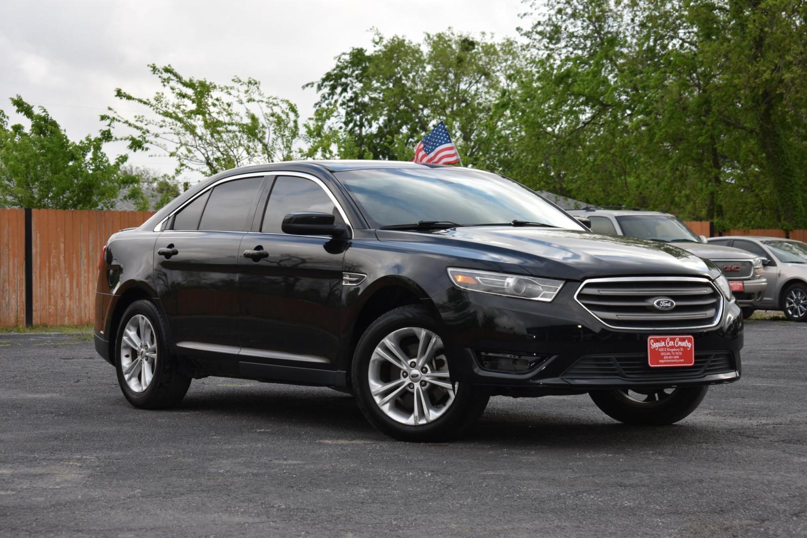 2015 BLACK Ford Taurus SEL FWD (1FAHP2E87FG) with an 3.5L V6 DOHC 24V engine, 6-Speed Automatic transmission, located at 420 E. Kingsbury St., Seguin, TX, 78155, (830) 401-0495, 29.581060, -97.961647 - Photo#1