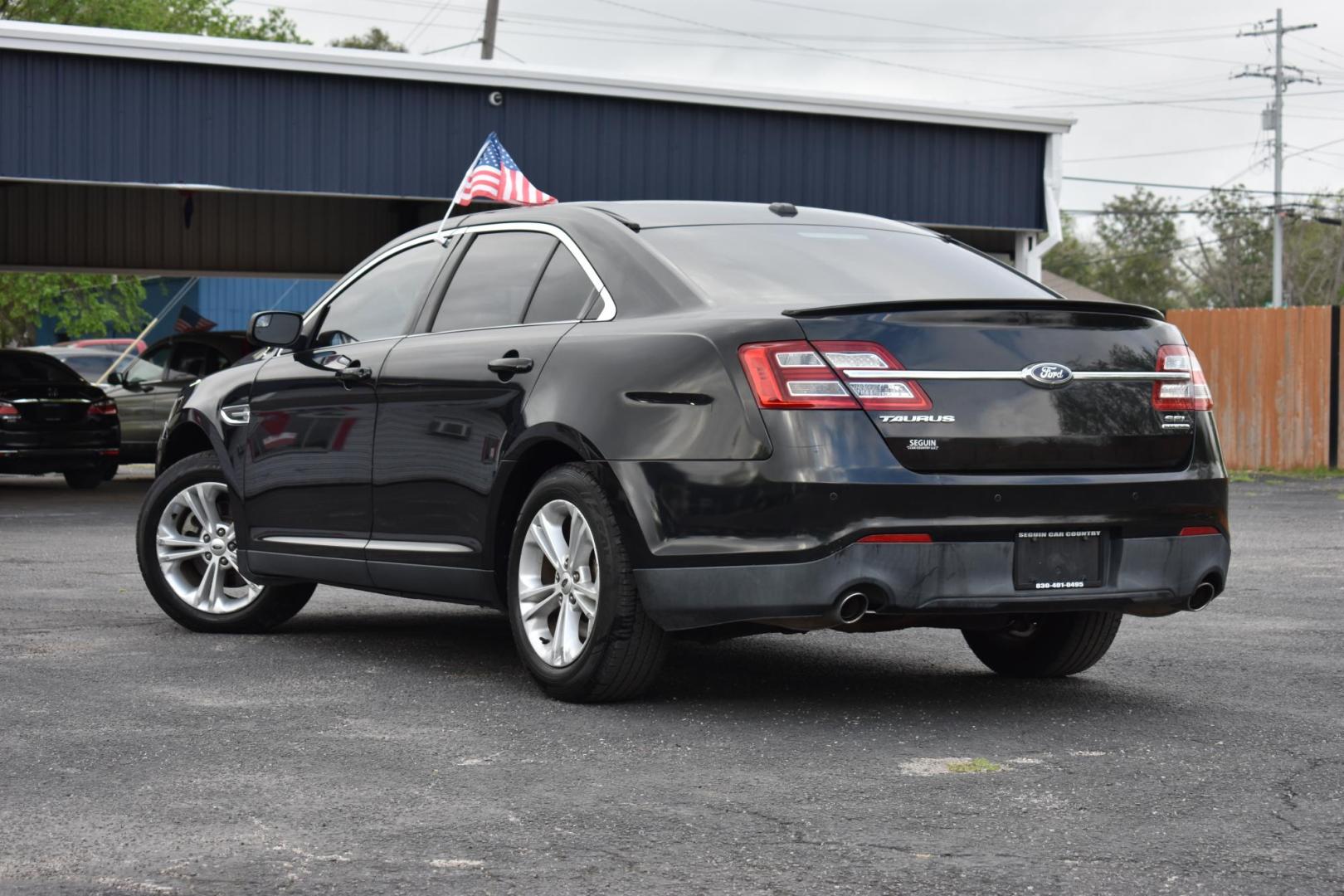 2015 BLACK Ford Taurus SEL FWD (1FAHP2E87FG) with an 3.5L V6 DOHC 24V engine, 6-Speed Automatic transmission, located at 420 E. Kingsbury St., Seguin, TX, 78155, (830) 401-0495, 29.581060, -97.961647 - Photo#2