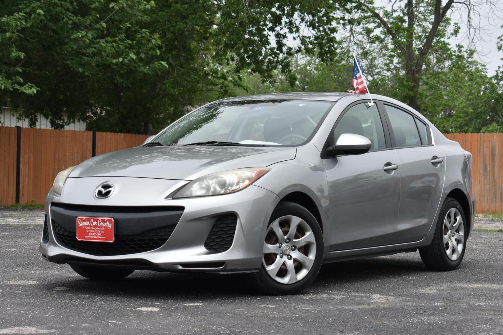 2013 SILVER Mazda MAZDA3 i SV MT 4-Door (JM1BL1TF7D1) with an 2.0L L4 DOHC 16V engine, 5-Speed Manual transmission, located at 420 E. Kingsbury St., Seguin, TX, 78155, (830) 401-0495, 29.581060, -97.961647 - Photo#2