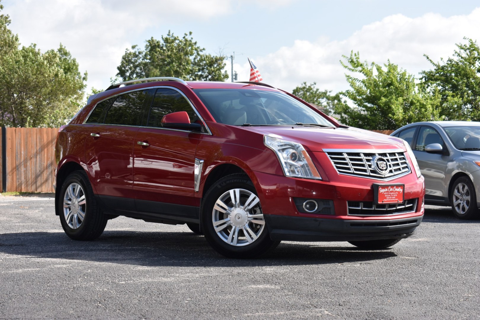 2016 RED CADILLAC SRX Luxury Collection FWD (3GYFNBE34GS) with an 3.6L V6 DOHC 24V FFV engine, 6-SPEED AUTOMATIC transmission, located at 420 E. Kingsbury St., Seguin, TX, 78155, (830) 401-0495, 29.581060, -97.961647- Photo#0