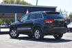 2013 BLACK JEEP GRAND CHEROKEE Limited 4WD (1C4RJFBG7DC) with an 3.6L V6 DOHC 24V engine, 5-SPEED AUTOMATIC transmission, located at 420 E. Kingsbury St., Seguin, TX, 78155, (830) 401-0495, 29.581060, -97.961647- Photo#1